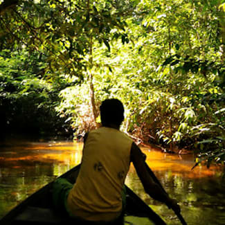 Small paddling boat on the small river canal