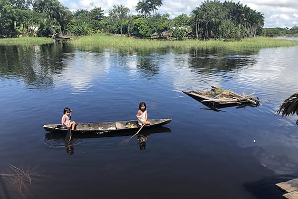 Amazon Dream's 10-Day Amazon & Tapajos Rivers Cruise Itinerary Day Nine - Natives canoeing.