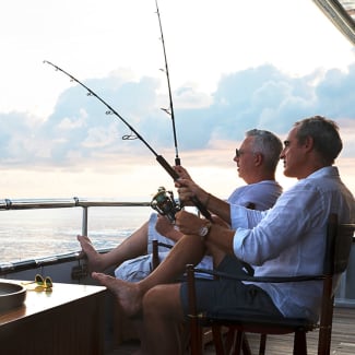 Two men fishing from the deck