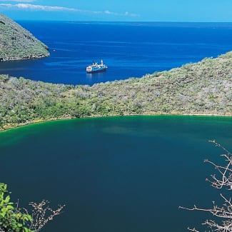 Galapagos landscape with Isabella Yacht in sight