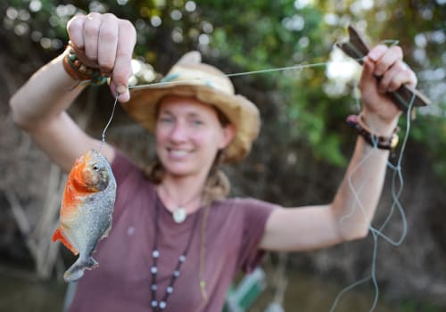 Young Woman is Piranha Fishing